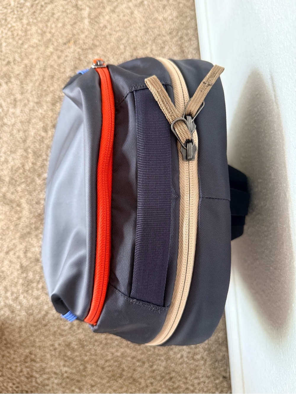 cotopaxi Black Sling Backpack with Blue Piping and Red Zip Pull - Picture 4 of 10